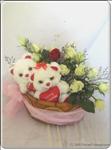 a pair of small bear(15cm height) with 14 roses.Show her your true feelings with this elegant arrangement