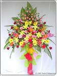 This artful arrangement includes lilies, roses, orchids, gerbera, and greens. So bright and cheerful, it will make any party more joyous no matter which one. Approximately 1m8 H.