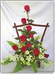 Includes red roses and white orchids and fresh greens in a  sophisticated arrangement -  always a work of art.  It"s a great gift for very occasion. Approximately 50cm H x 40cm W.