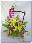 Show your love one that you are thinking of them on their special day. This gorgeous arrangement includes purple orchid, yellow lilies, pink roses and other greenery.