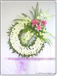 White orchids are artfully arranged in this sophisticated wreath and accented with pink lilies.  Appropriate to send to the funeral service. Arrangement is delivered with an easel for display.
The delivered stand is 1.5m high
