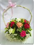 These gorgeous carnations are sure to bring a smile to anyone"s face! This handle basket holds 12 assorted carnations with greens. A terrific gift for any occasion. 